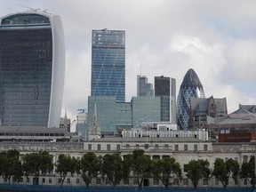 FILE- In this Wednesday, Sept. 2, 2015, a view of some buildings in the City of London, London. A group of London‚Äôs financial lobbyists will head to Brussels on Wednesday, July 5, 2017, for their first meeting with officials and stakeholders since Brexit talks began. (AP Photo/Frank Augstein)