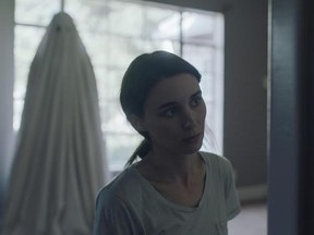 This image released by A24 shows Rooney Mara in a scene from the film, &ampquot;A Ghost Story.&ampquot; (Bret Curry/A24 via AP)