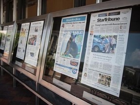 Newspaper front pages are displayed at the Newseum in Washington, Monday, July 10, 2017. News outlets are seeking permission from Congress for the right to negotiate jointly with Google and Facebook, two companies that dominate online advertising and online news traffic. (AP Photo/Carolyn Kaster)