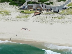 In this Sunday, July 2, 2017, photo, New Jersey Gov. Chris Christie uses the beach with his family and friends at the governor&#039;s summer house at Island Beach State Park in New Jersey. Democratic Assemblyman John Wisniewski said Friday, July 7, 2017, he has introduced a bill that would let the public rent the house on Island Beach State Park that is now reserved for the governor. A second bill would prevent the beach house to be used by the governor during any state shutdown. (Andrew Mills/NJ Adv