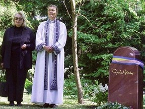 In this June 17, 1999 file photo, Gray Gustafson Reisfield, left, and Bishop Caroline Krook stand next to the tombstone of Greta Garbo after the memorial service at the Woodland Cemetery in Stockholm, Sweden. Reisfield, the sole heiress to her aunt Greta Garbo&#039;s estate and a woman who was a long-time companion to the late Swedish-born actress, has died, a family member said Monday, July 10, 2017.