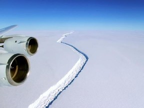 This Nov. 10, 2016 aerial photo released by NASA, shows a rift in the Antarctic Peninsula&#039;s Larsen C ice shelf. A vast iceberg with twice the volume of Lake Erie has broken off from a key floating ice shelf in Antarctica, scientists said Wednesday July 12, 2017 . The iceberg broke off from the Larsen C ice shelf, scientists at the University of Swansea in Britain said. The iceberg, which is likely to be named A68, is described as weighing 1 trillion tons (1.12 trillion U.S. tons).(John Sonntag/N