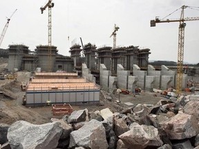 The construction site of the hydroelectric facility at Muskrat Falls, Newfoundland and Labrador is seen on Tuesday, July 14, 2015. A nagging dread is keeping Craig Chaulk up at night. He lives downstream from the $12.7-billion Muskrat Falls hydroelectric development in Labrador. He&#039;s among many residents concerned that a crucial part of the dam, a jut of sand and clay called the North Spur, could give way.THE CANADIAN PRESS/Andrew Vaughan