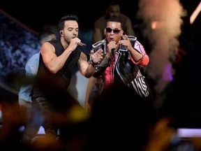 FILE - In this April 27, 2017 file photo, singers Luis Fonsi, left and Daddy Yankee perform during the Latin Billboard Awards in Coral Gables, Fla. Universal Music Latin Entertainment announced Wednesday, July 19, 2017, that &ampquot;Despacito&ampquot; has become the most streamed song of all time with more than 4.6 billion plays six months after its release. The song by Luis Fonsi and Daddy Yankee, and a companion remix featuring Justin Bieber, has surpassed the 4.38 billion plays recorded for the previous rec