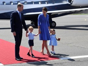 Britain&#039;s Prince William, left and Kate, the Duchess of Cambridge, second right, have arrived with their children, Prince George, second left and Princess Charlotte, at Tegel airport in Berlin, Wednesday, July 19, 2017. They arrived for a three- days-visit to Germany. William and Kate are scheduled to visit Heidelberg and Hamburg as well as Berlin. They arrived in Germany after a visit to Poland. (Bernd Von Jutrczenka/dpa via AP)