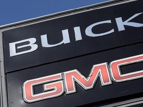 In this April 25, 2017, photo, a General Motors dealer&#039;s sign displays the Buick and GMC brands in Nashville, Tenn. General Motors Co. reports financial results, Tuesday, July 25, 2017. (AP Photo/Mark Humphrey)