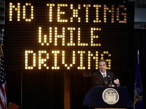 FILE - In this May 31, 2013 file photo, New York Gov. Andrew Cuomo speaks during a news conference to announce the increase in penalties for texting while driving in New York. New York state is set to study the use of a device known as the ‚Äútextalyzer‚Äù that would allow police to determine whether a motorist involved in a serious crash was texting while driving. Cuomo announced Wednesday, July 26, 2017, that he would direct the Governor‚Äôs Traffic Safety Committee to examine the technology,