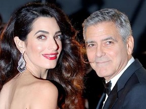 FILE - In this Feb. 24, 2017, file photo actor George Clooney and Amal Clooney arrive at the 42nd Cesar Film Awards ceremony at Salle Pleyel in Paris. George Clooney said in a statement on July 28, 2017, that photographers who captured images of him and his wife, human rights lawyer Amal Clooney, cradling their newborn twins will be ‚Äúprosecuted to the fullest extent of the law.‚Äù (AP Photo/Francois Mori, File)