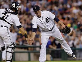 Detroit Tigers relief pitcher Justin Wilson greets catcher Alex Avila after the team&#039;s 5-3 win over the Houston Astros in a baseball game, Saturday, July 29, 2017, in Detroit.