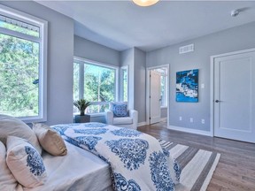 Coastal:  This lovely coastal-inspired master bedroom uses bold prints balanced with sky-blue walls, driftwood-like flooring and hints of the sea and sand throughout the room.