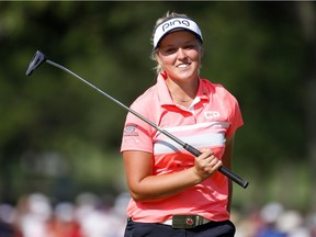 Smiths Falls' Brooke Henderson smiles after her near miss for eagle on the final hole of Sunday's round. A tie for second in the KPMG Women's PGA Championship helped boost her to eighth in the world rankings released Monday. Gregory Shamus/Getty Images