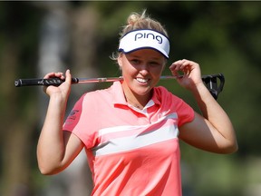 Brooke Henderson reacts to a missed eagle putt that came up one roll short of the cup on the 18th hole on Sunday. Gregory Shamus/Getty Images