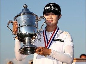Sung Hyun Park of South Korea poses with the trophy after winning the U.S. Women's Open on Sunday in Bedminster, N.J.  Elsa/Getty Images