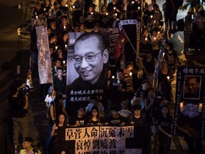 People attend a candlelight march for the late Chinese Nobel laureate Liu Xiaobo in Hong Kong on July 15, 2017. Liu died on July 13.( AFP PHOTO / DALE DE LA REYDALE DE LA REY/AFP/Getty Images.)