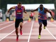 Andre De Grasse, left, of Markham, Ont., powers over the finish line to win gold in the men's 100-metre race of the Canadian Track and Field Championships at the Terry Fox Athletic Facility on Friday. Gavin Smellie, right, of Brampton, Ont., finished third. THE CANADIAN PRESS/Fred Chartrand