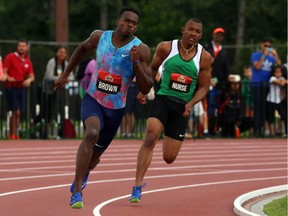 Aaron Brown, left, races to victory in his heat of the 200 metres on Saturday with a best-overall time of 20.31 seconds. Cameron Nurse, right, of Mississauga, Ont., was third in the heat and 14th overall in 21.50 seconds at the Terry Fox Athletic Facility. THE CANADIAN PRESS/Fred Chartrand