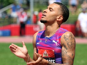 Double men's sprint champion Andre De Grasse reacts after winning gold in the 200 metres on Sunday at the Terry Fox Athletic Centre. THE CANADIAN PRESS/Fred Chartrand