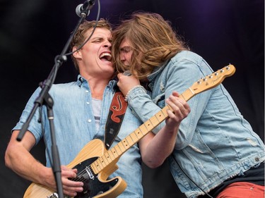 Jay Emmons (L) and lead singer Brett Emmons of The Glorious Sons from Kingston during an RBC Bluesfest performance on Friday. Wayne Cuddington/Postmedia