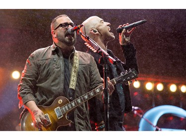 Lead singer Ed Kowalczyk, right, and guitar Chad Taylor of LIVE band on the City Stage as day eight of the RBC Bluesfest takes place on the grounds of the Canadian War Museum at Lebreton Flats.  Wayne Cuddington/Postmedia