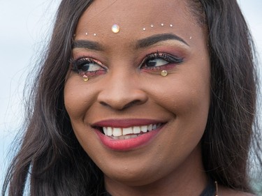 A bedazzled hip hop fan waits for Migos to perform as day seven of the RBC Bluesfest takes place on the grounds of the Canadian War Museum.