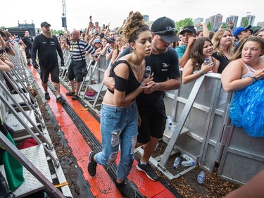 A fan of rapper Fetty Wap is overcome with heat etc and taken out of the crowd by staff as day five of the RBC Bluesfest takes place on the grounds of the Canadian War Museum.