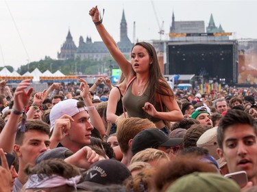 Fans of rapper Fetty Wap cheer as day five of the RBC Bluesfest takes place on the grounds of the Canadian War Museum.