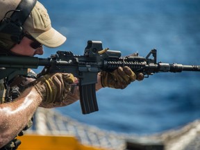 Members of the Maritime Tactical Operations Group (MTOG), aboard HMCS WINNIPEG, carry out a live fire exercise with C8 carbines during POSEIDON CUTLASS on June 8, 2017. Photo: Cpl Carbe Orellana, Canadian Forces.