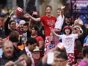 From left: Jasmine Flood, Ainsley Johnstone, Rowen Flood, Braeden Johnstone make the best of a swampy Parliament Hill on Canada Day.