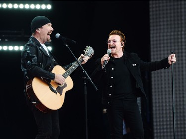 U2's The Edge and Bono perform during Canada 150 celebrations on Parliament Hill in Ottawa on Saturday.