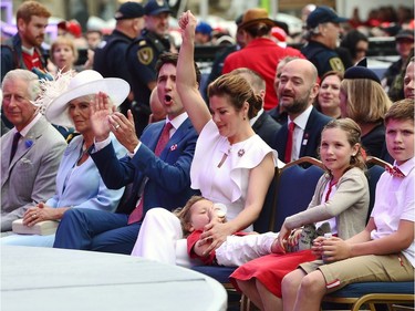 Prince Charles, left to right, Camilla Duchess of Cornwall, Prime Minister Justin Trudeau, Sophie Gregoire Trudeau, Hadrien Trudeau, Ella-Grace Trudeau and Xavier Trudeau take part in Canada 150 celebrations on Parliament Hill in Ottawa on Saturday, July 1, 2017.