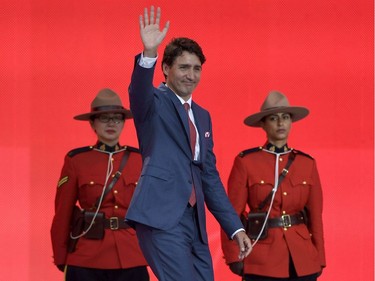 Prime Minister Justin Trudeau waves during the Canada Day noon hour show on Parliament Hill in Ottawa on Saturday, July 1, 2017.