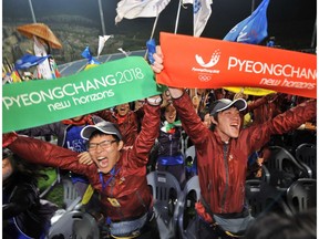 South Koreans celebrate after after obtaining a first-round majority in the vote that Pyeongchang will host the 2018 Winter Olympics, during a night rally to support the bid in Pyeongchang, in 2011.