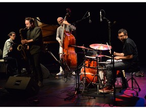 The Mark Guiliana Quartet (left to right Fabian Almazan, Jason Rigby, Chris Morrisey and Mark Guiliana) at the 2017 TD Ottawa Jazz Festival
