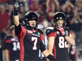 Quarterback Trevor Harris (7) waves to fans after the Redblacks clinched their first victory of the 2017 season against the Alouettes at TD Place stadium on Wednesday night. THE CANADIAN PRESS/Sean Kilpatrick