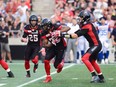 Redblacks running back William Powell, seen taking a handoff from QB Trevor Harris in Wednesday's home game against the Alouettes, could also see some duty on kickoff returns against the Argos in Toronto on Monday night. THE CANADIAN PRESS/Sean Kilpatrick
