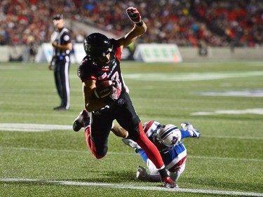 Ottawa Redblacks wide receiver Brad Sinopoli (88) scores a touchdown past Montreal Alouettes defensive back Tyree Hollins (26) during second half CFL football action in Ottawa on Wednesday, July 19, 2017.