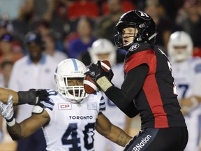 Redblacks quarterback Trevor Harris (7), under pressure from the Argos' Shawn Lemon in last Saturday's game, has been sacked nine times so far this season, tied for second-most in the CFL. THE CANADIAN PRESS/Patrick Doyle