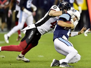 Toronto Argonauts quarterback Ricky Ray (15) gets tackled on a run by Ottawa Redblacks defensive end Arnaud Gascon-Nadon (41) during first half CFL action in Toronto, Monday, July 24, 2017.