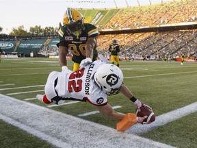 Redblacks receiver Greg Ellingson (82) reaches for what appears to be a touchdown, but he had stepped out of bounds before he got there during the second quarter on Friday. THE CANADIAN PRESS/Jason Franson