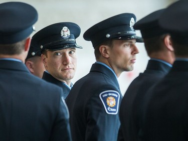 Recruits wait to march into council chambers as Ottawa Fire Services hosts a graduation ceremony to welcome its newest probationary firefighters at Ottawa City Hall.