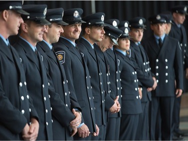 Sixteen new recruits wait to march into council chambers as Ottawa Fire Services hosts a graduation ceremony to welcome its newest probationary firefighters at Ottawa City Hall.