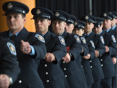 Sixteen new recruits march into council chambers as Ottawa Fire Services hosts a graduation ceremony to welcome its newest probationary firefighters at Ottawa City Hall.