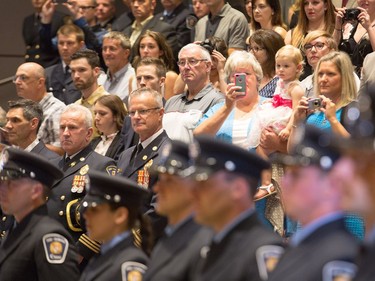 Family members in the galleries as Ottawa Fire Services hosts a graduation ceremony to welcome its newest probationary firefighters at Ottawa City Hall.