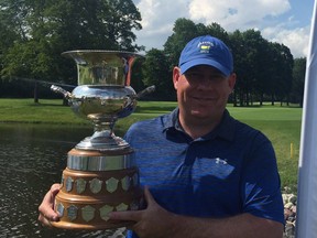 Robert Mackay of Orléans shows off the Lord Alexander of Tunis trophy after winning the two-round Golf Quebec men's amateur golf tournament at Rivermead Golf Club on Monday. Golf Quebec photo