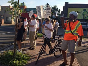 Those protesting the Salvation Army's plan to relocate to Montreal Road stand outside the Vanier Community Service Centre on Friday.