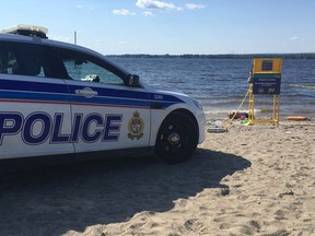 Ottawa police are at the scene after a man was found unresponsive in the water at Britannia Beach on Saturday, July 15, 2016. Kelly Egan, Postmedia