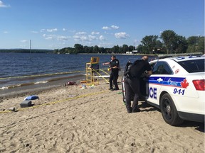 Ottawa police are at the scene after a man was found unresponsive in the water at Britannia Beach on Saturday, July 15, 2016.