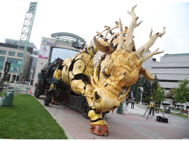 Long Ma, the dragon-horse, sleeps on the grounds of the Ottawa City Hall, July 27, 2017.