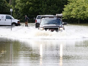 Perkins Drive in North Gower remained flooded Tuesday after heavy rain hit the city on Monday,
