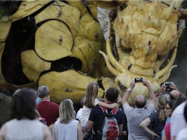 Thousands gathered to see La Machine's mechanical dragon-horse Long Ma walk from Chaudière Falls to meet its giant spider counterpart Kumo at the National War Museum for their grand finale on Sunday. David Kawai/Postmedia